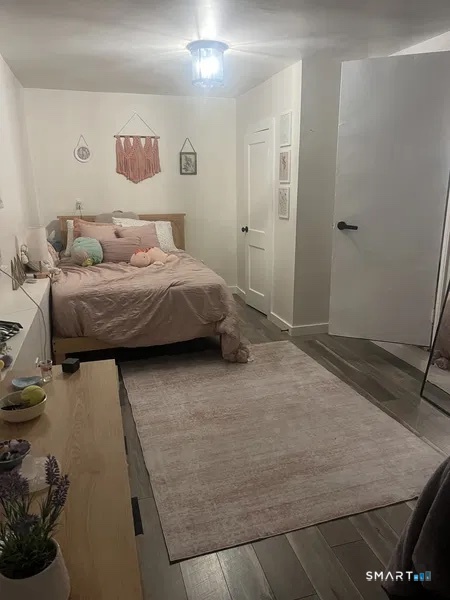 107 Richfield Road Bridgeport, CT 06606 - Photo 11 of 24 a bedroom with a bed and a table