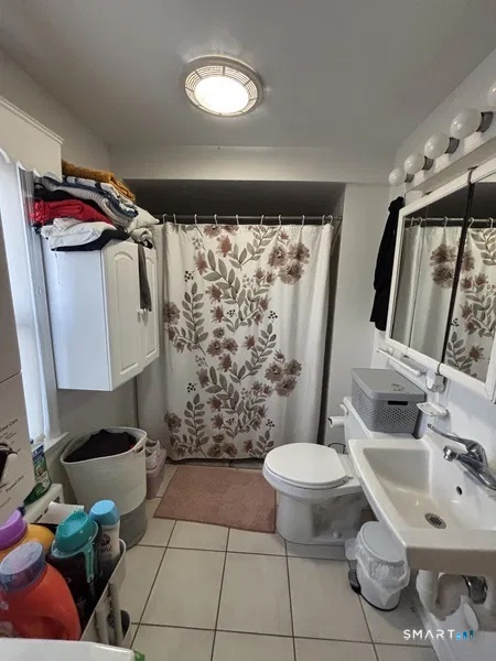 107 Richfield Road Bridgeport, CT 06606 - Photo 15 of 24 a bathroom with a toilet sink and shower