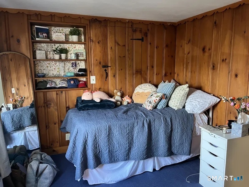 107 Richfield Road Bridgeport, CT 06606 - Photo 16 of 24 a bedroom with a bed and a dresser