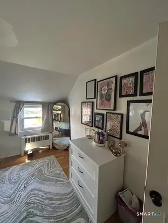 a bed room with a bed and a tv