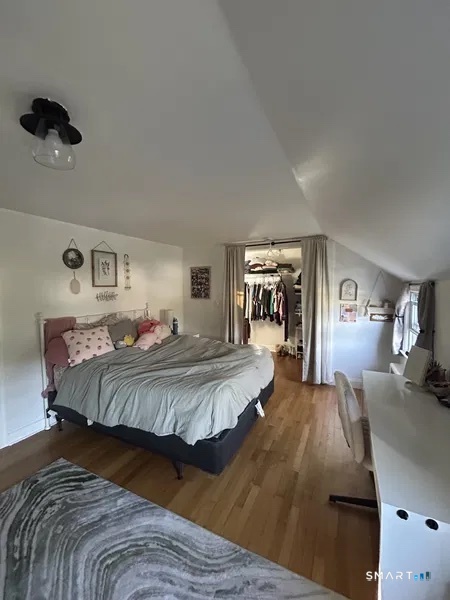 107 Richfield Road Bridgeport, CT 06606 - Photo 20 of 24 a bed room with a bed mirror and a night stand