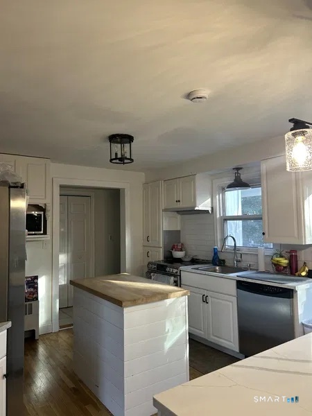 107 Richfield Road Bridgeport, CT 06606 - Photo 21 of 24 a kitchen with granite countertop a sink and cabinets