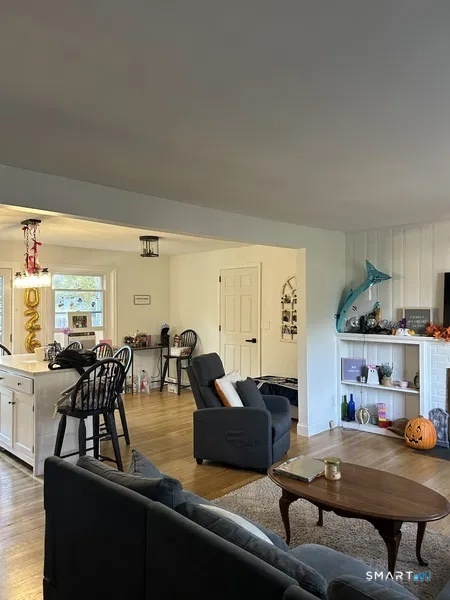 107 Richfield Road Bridgeport, CT 06606 - Photo 5 of 24 a living room with furniture and view of kitchen