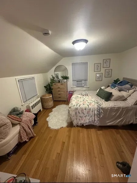 107 Richfield Road Bridgeport, CT 06606 - Photo 6 of 24 a bedroom with bed and wooden floor