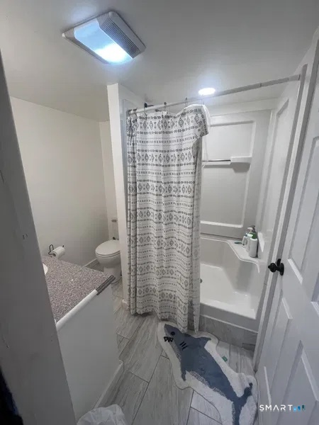 107 Richfield Road Bridgeport, CT 06606 - Photo 7 of 24 a bathroom with a shower toilet and sink
