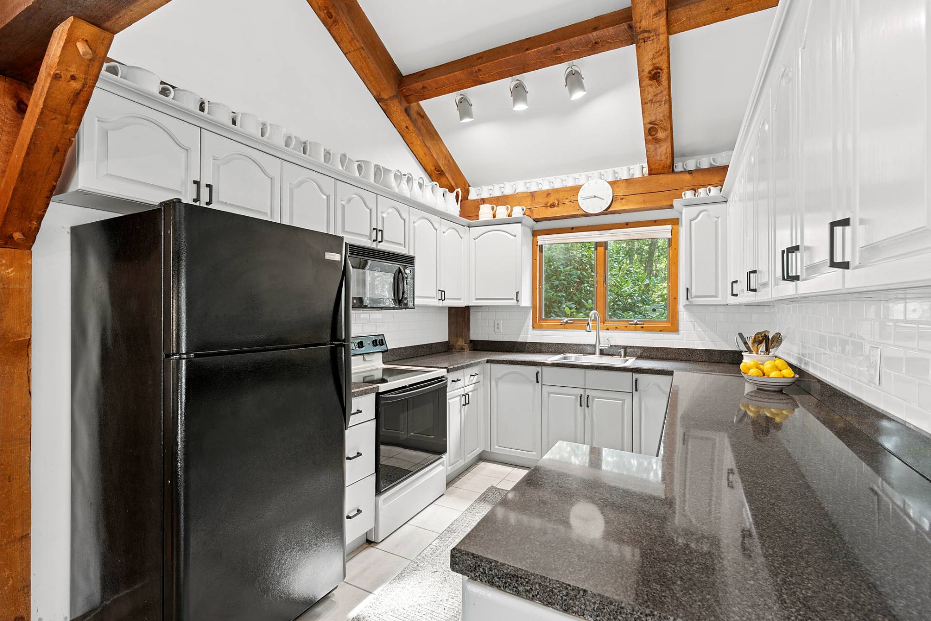 11 Ridge Road East Hampton, NY 11937 - Photo 11 of 19 a kitchen with a sink a refrigerator and window