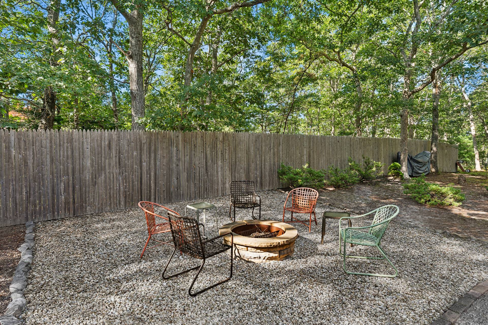 11 Ridge Road East Hampton, NY 11937 - Photo 14 of 19 a backyard of a house with outdoor seating