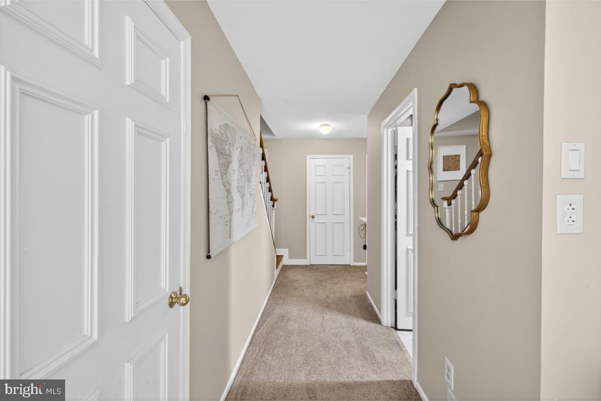 7347 Swan Point Way, Unit 122 Columbia, MD 21045 - Photo 30 of 54 a view of a livingroom with wooden floor and entryway