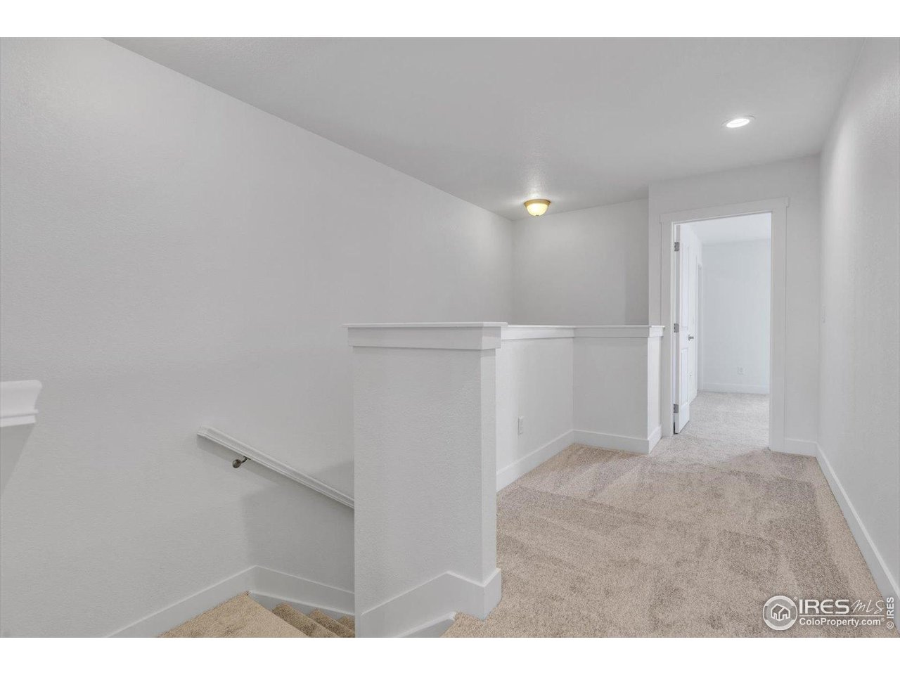 749 Robert Street Longmont, CO 80503 - Photo 21 of 43 Wide stairwell & hallway with room for a desk