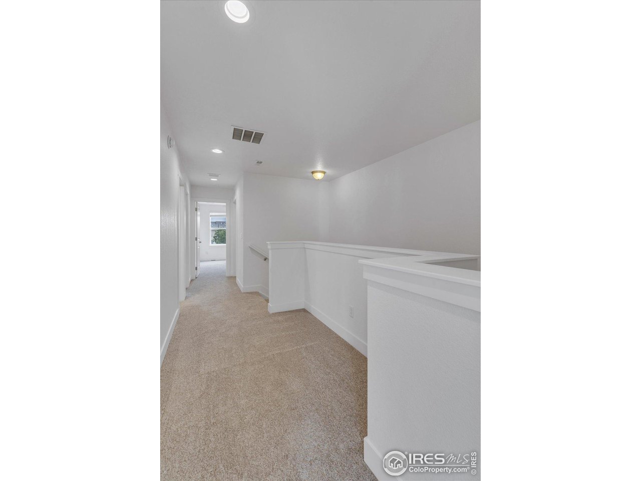 749 Robert Street Longmont, CO 80503 - Photo 22 of 43 Wide hallway with room for a desk