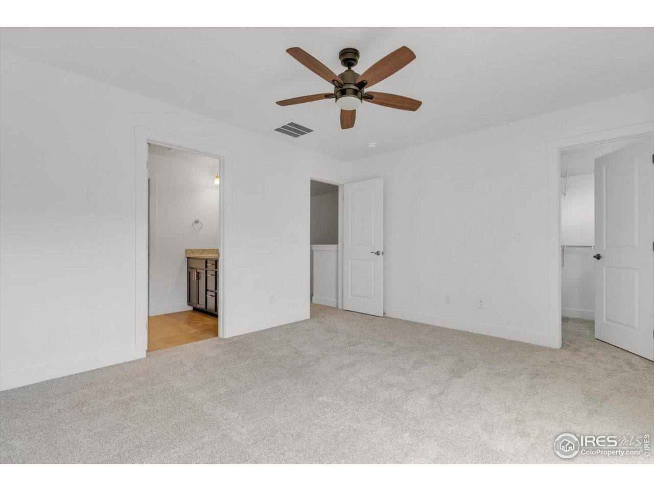 749 Robert Street Longmont, CO 80503 - Photo 29 of 43 Primary bedroom suite