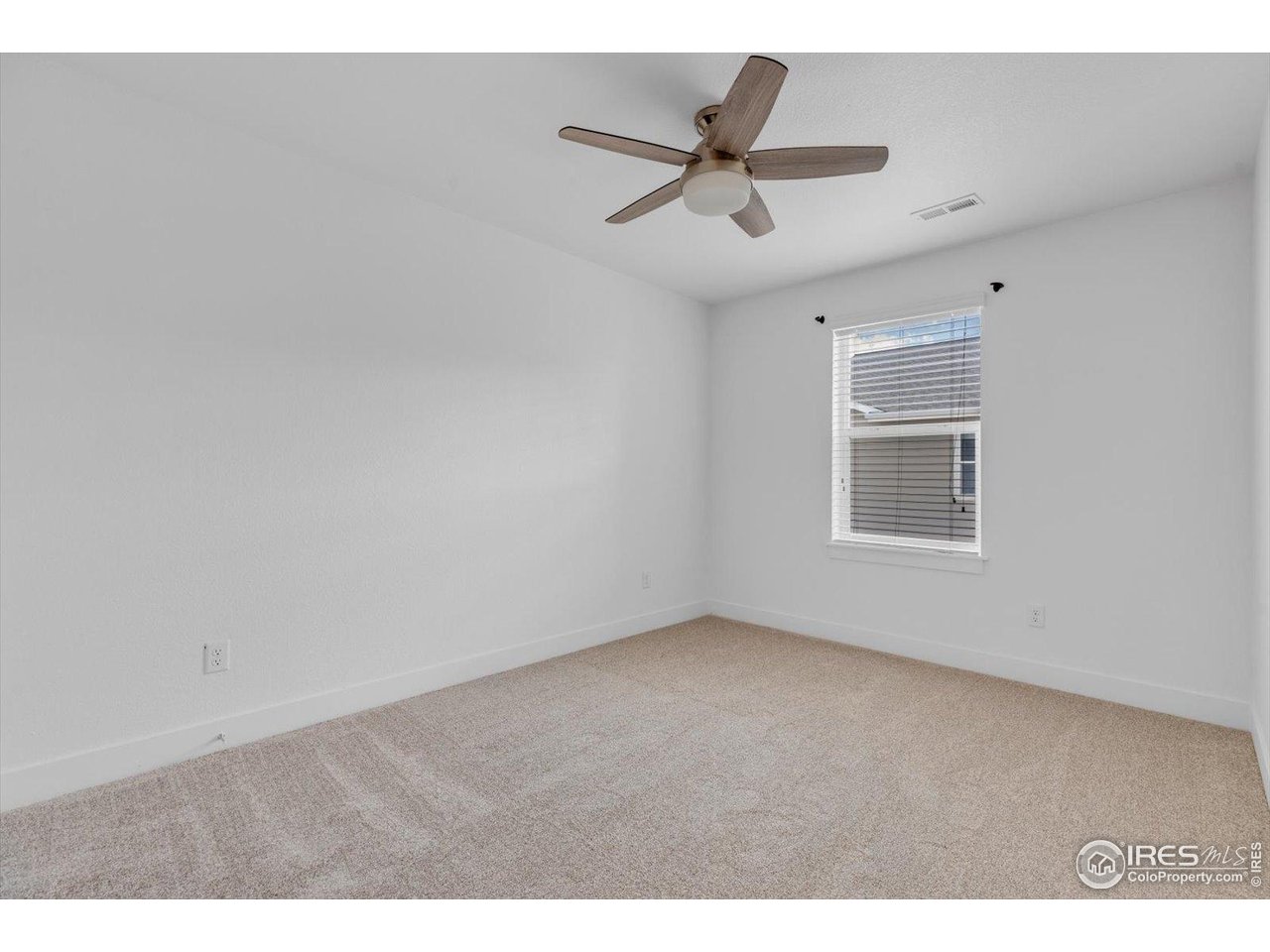 749 Robert Street Longmont, CO 80503 - Photo 35 of 43 Second bedroom (opposite primary)