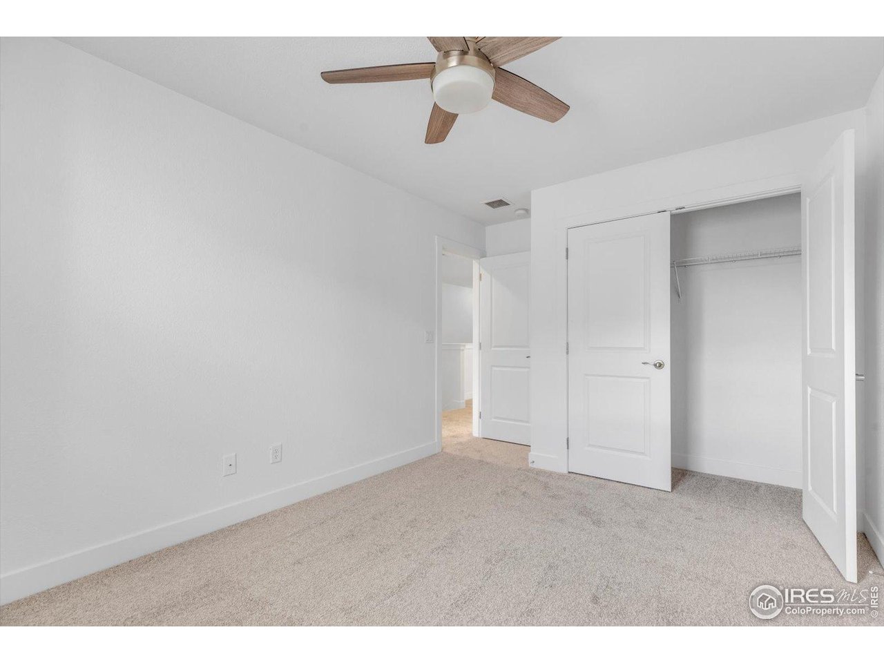 749 Robert Street Longmont, CO 80503 - Photo 38 of 43 Third bedroom (opposite primary)