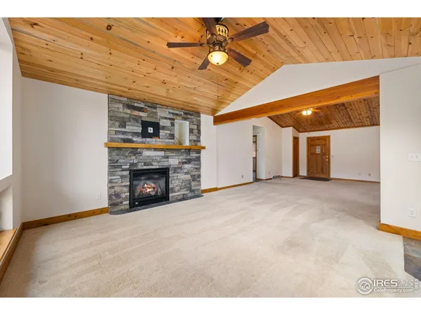 a view of an empty room with a fireplace