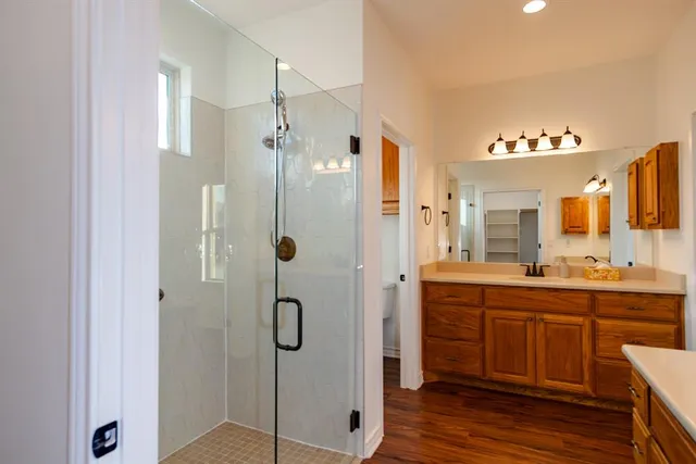 a bathroom with a shower and a sink