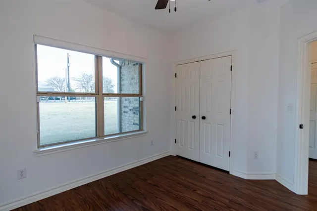 a bathroom with a sink toilet a mirror and vanity