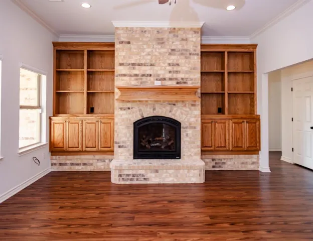 a kitchen with stainless steel appliances granite countertop a sink a refrigerator and a granite counter tops