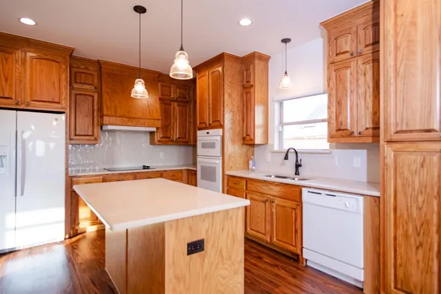 a view of wooden floor and windows in a room