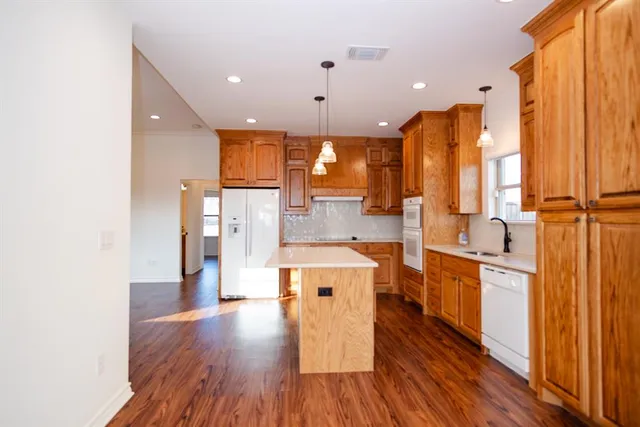 a spacious bathroom with a shower sink and mirror