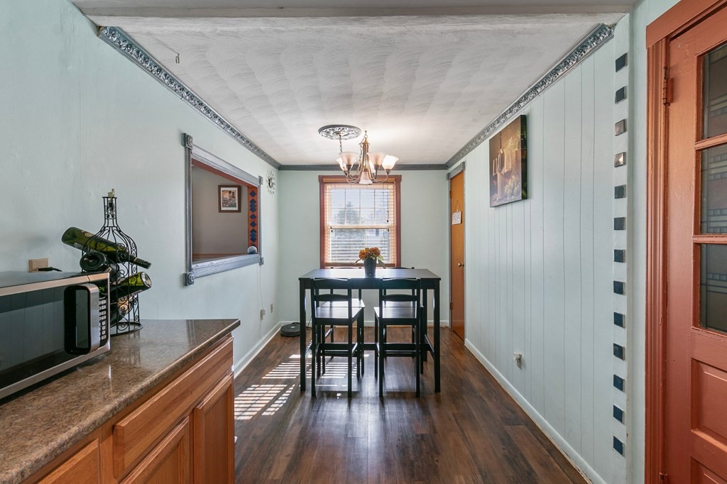 90 Newhouse Street Springfield, MA 01118 - Photo 13 of 36 a view of a dining room with furniture window and wooden floor