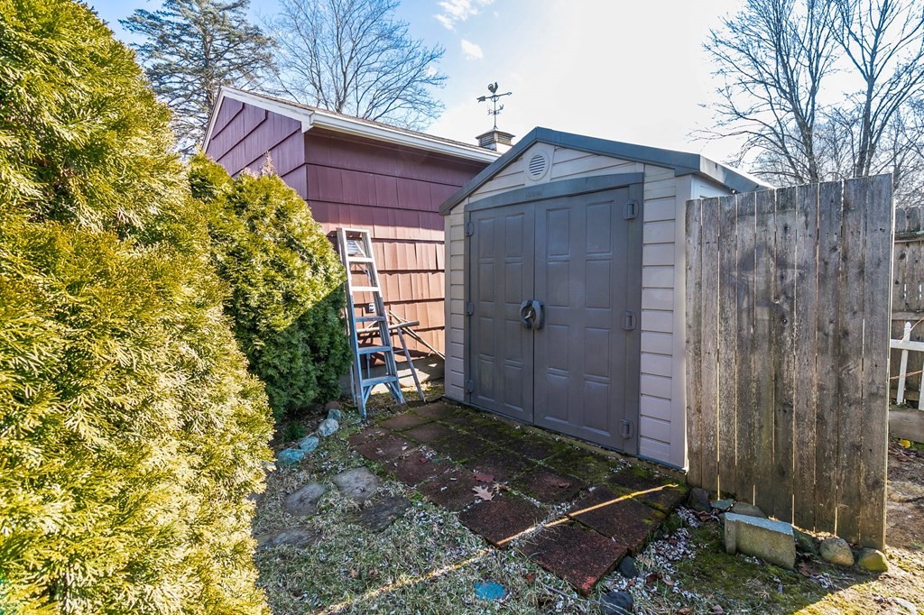 90 Newhouse Street Springfield, MA 01118 - Photo 24 of 36 a view of a wooden door and a yard