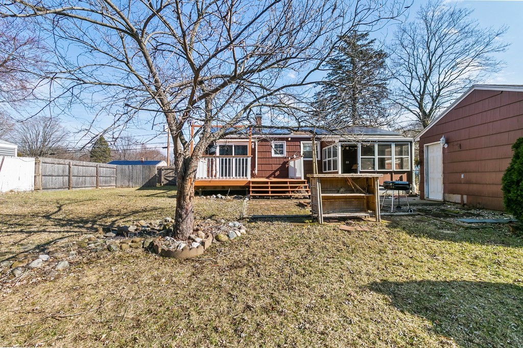 90 Newhouse Street Springfield, MA 01118 - Photo 25 of 36 a house with trees in front of it