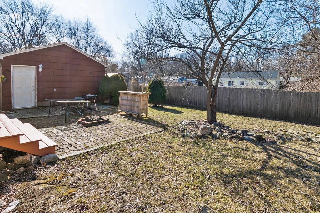 90 Newhouse Street Springfield, MA 01118 - Photo 29 of 36 a front view of house with yard outdoor seating and barbeque oven