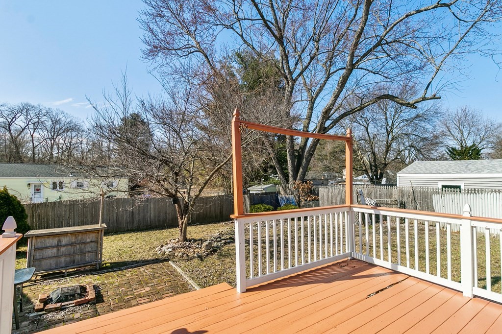 90 Newhouse Street Springfield, MA 01118 - Photo 31 of 36 a view of a wooden deck and a yard