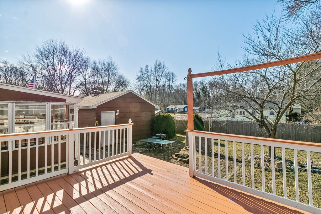 90 Newhouse Street Springfield, MA 01118 - Photo 32 of 36 a view of a wooden deck with large trees