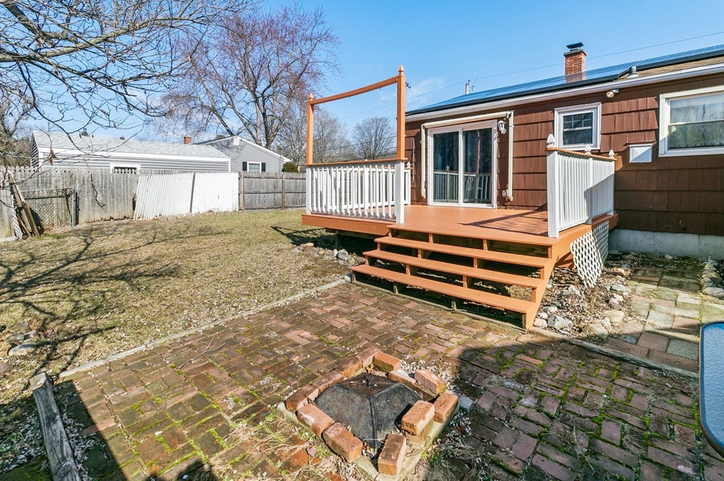90 Newhouse Street Springfield, MA 01118 - Photo 35 of 36 a backyard of a house with oven and outdoor seating