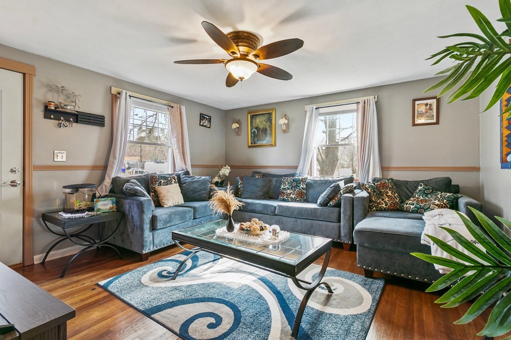 90 Newhouse Street Springfield, MA 01118 - Photo 7 of 36 a living room with furniture and a large window