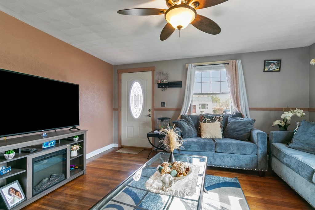 90 Newhouse Street Springfield, MA 01118 - Photo 9 of 36 a living room with furniture and a flat screen tv