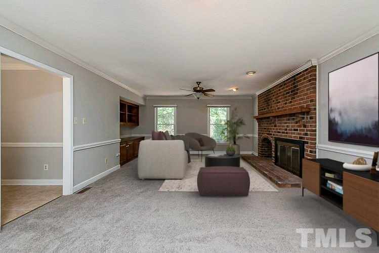 4714 Highgate Drive Durham, NC 27713 - Photo 2 of 22 a living room with furniture and a fireplace