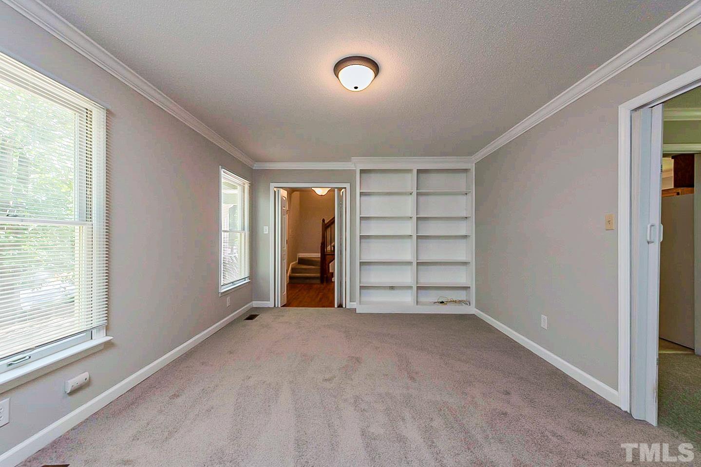 4714 Highgate Drive Durham, NC 27713 - Photo 12 of 22 a view of an empty room with a window and closet area