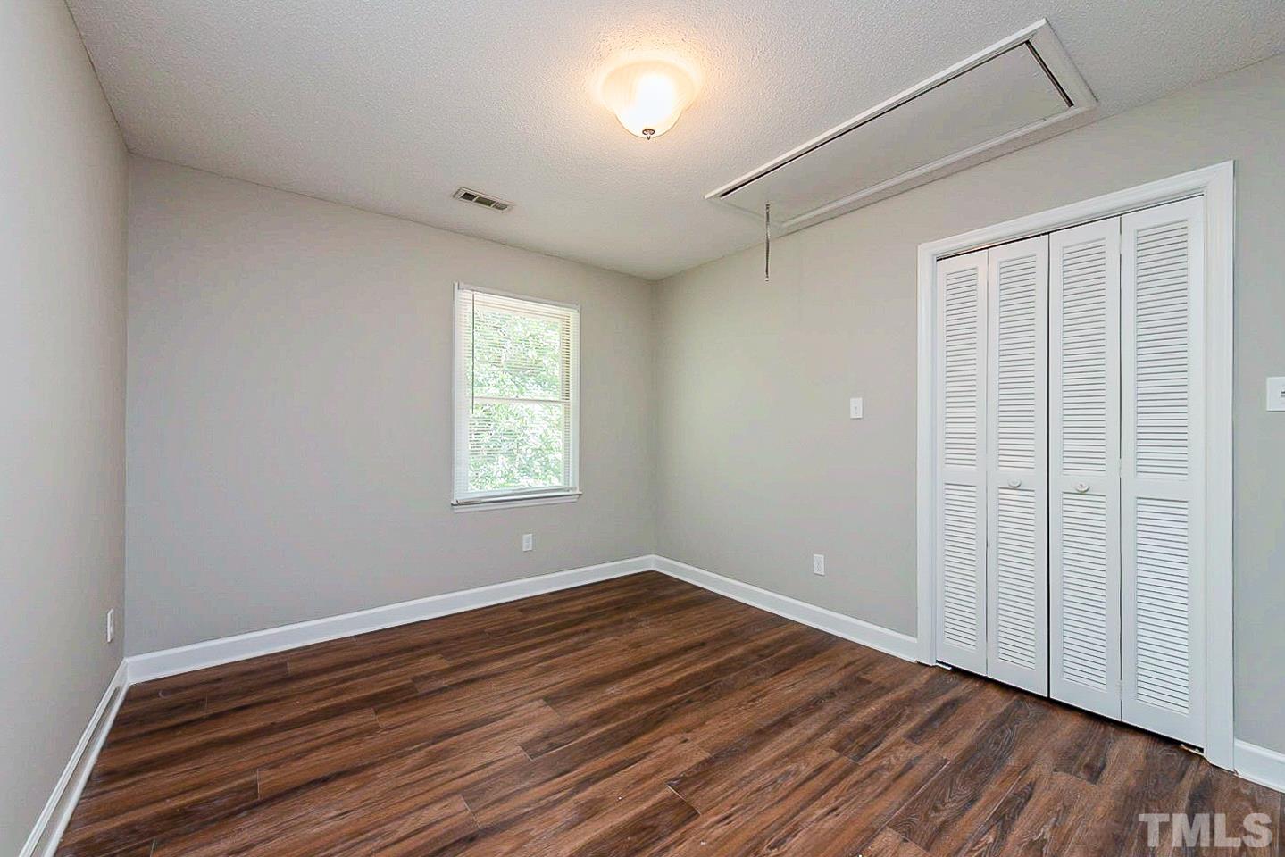 4714 Highgate Drive Durham, NC 27713 - Photo 14 of 22 wooden floor in an empty room with a window