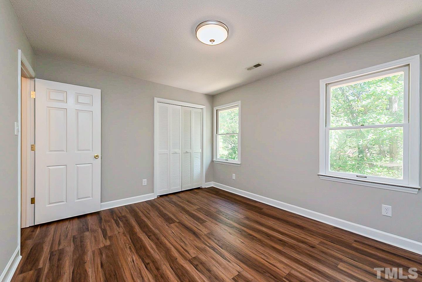 4714 Highgate Drive Durham, NC 27713 - Photo 16 of 22 a view of room with window and hardwood floor