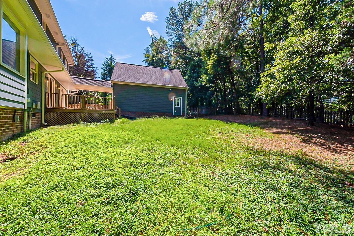 4714 Highgate Drive Durham, NC 27713 - Photo 21 of 22 a view of a house with a yard