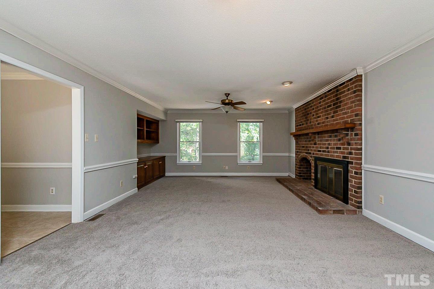 4714 Highgate Drive Durham, NC 27713 - Photo 4 of 22 a view of a livingroom with a fireplace and window