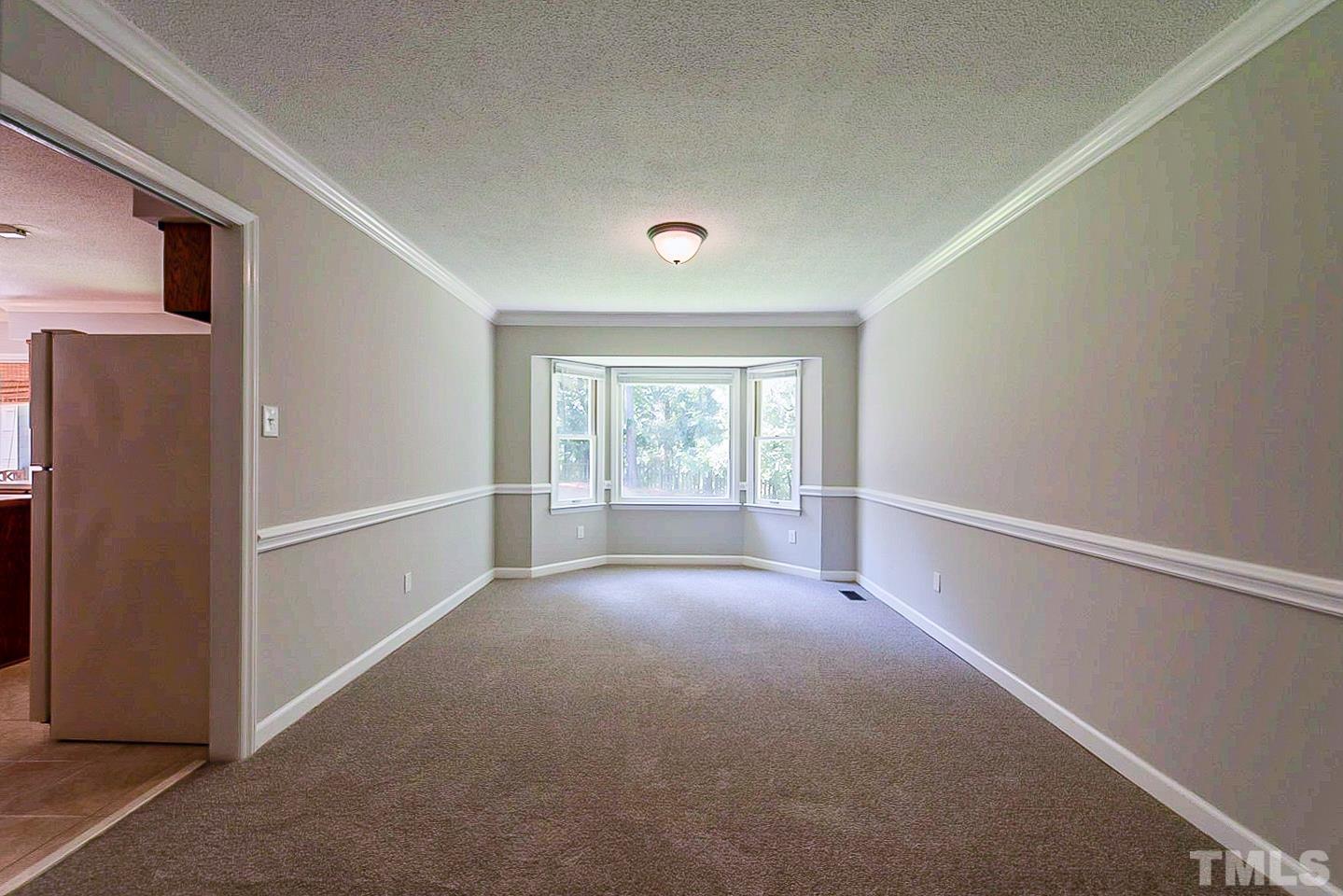 4714 Highgate Drive Durham, NC 27713 - Photo 8 of 22 a view of empty room with front door