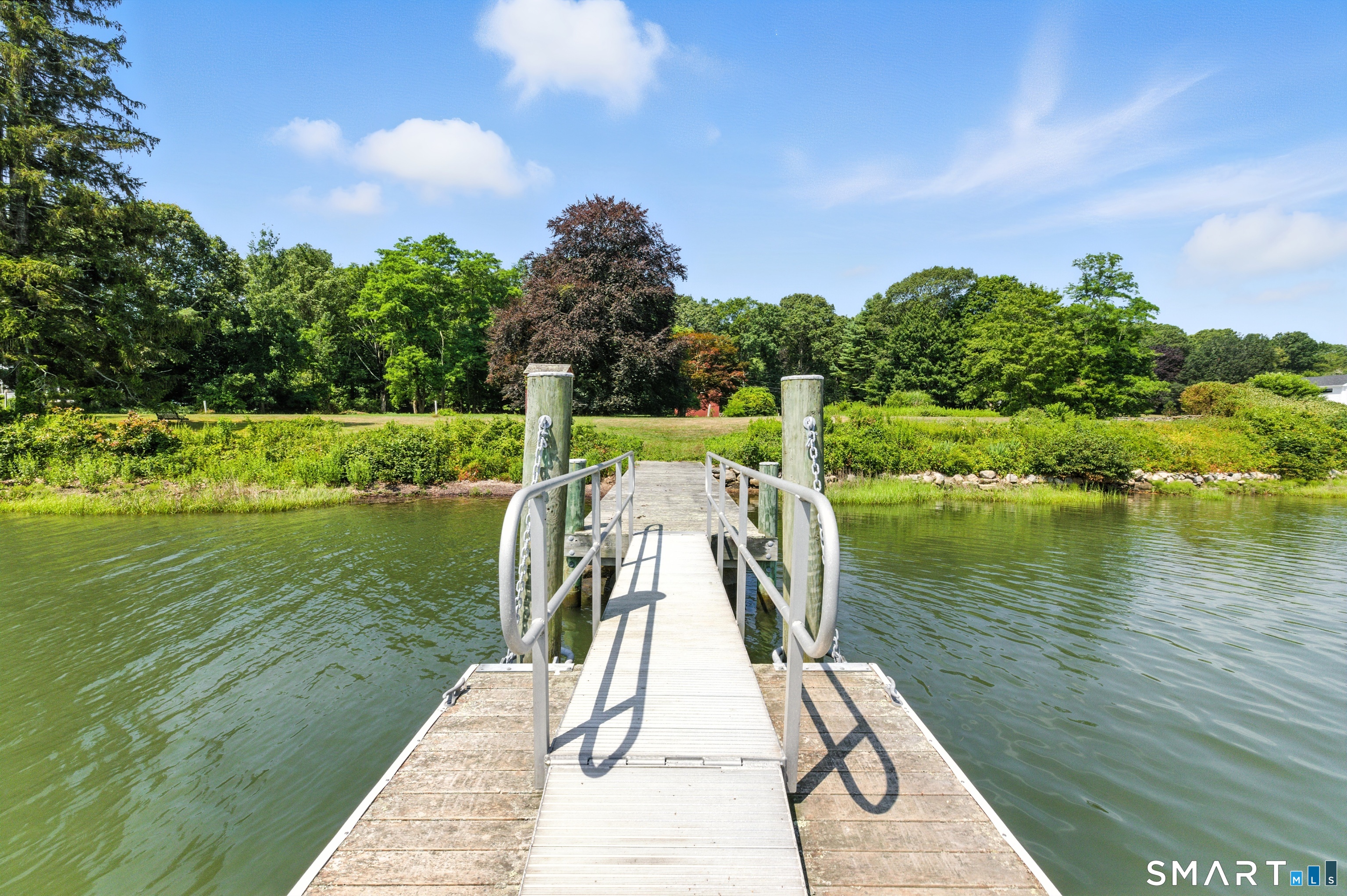 88 Cove Road Stonington, CT 06378 - Photo 11 of 27 a view of a lake with a large trees
