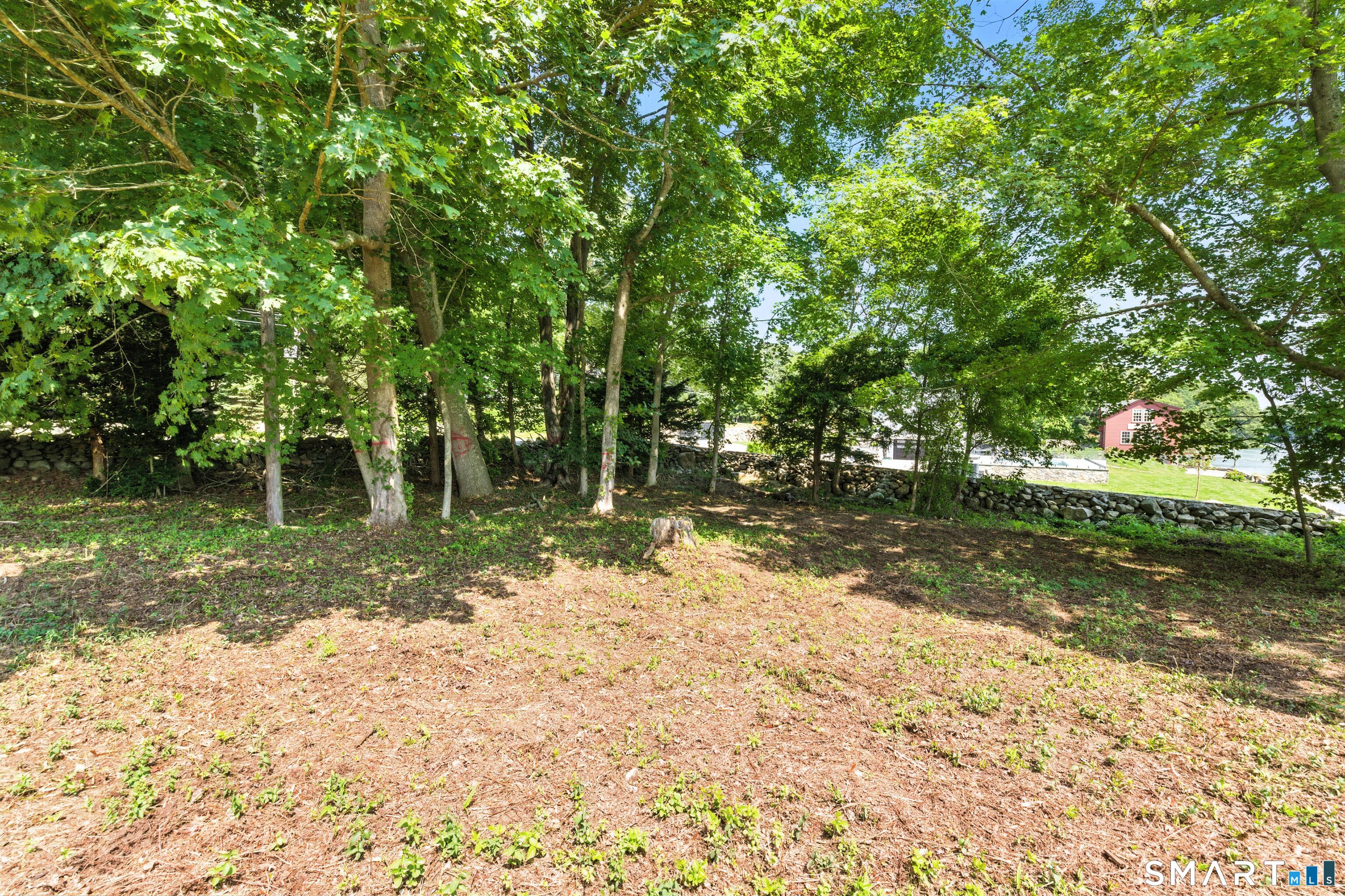 88 Cove Road Stonington, CT 06378 - Photo 14 of 27 a view of a yard with a tree