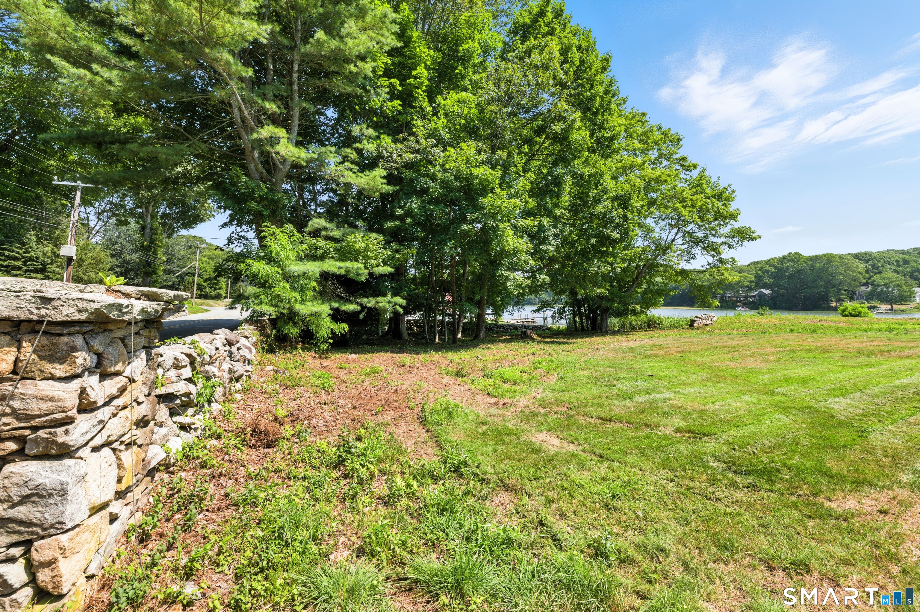 88 Cove Road Stonington, CT 06378 - Photo 16 of 27 a view of yard with green space