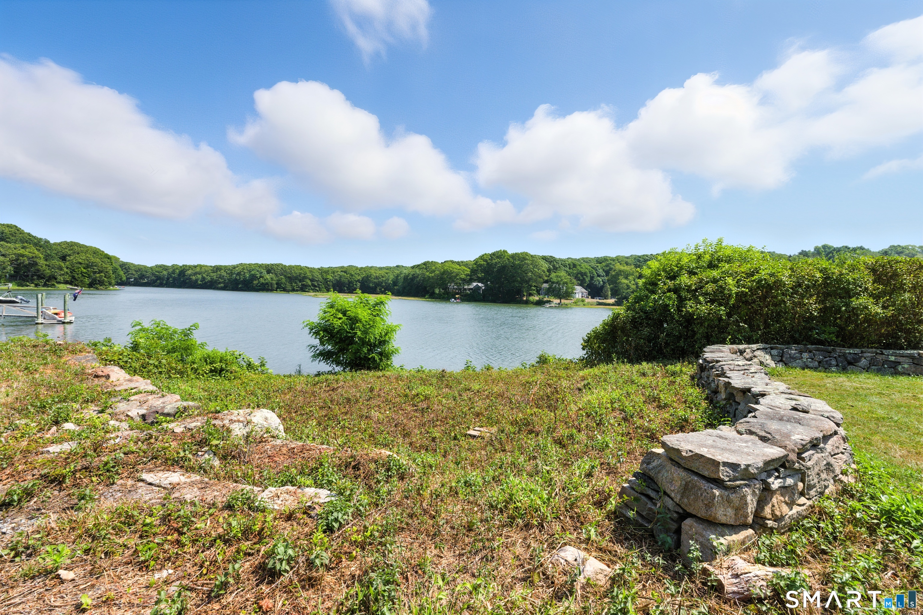 88 Cove Road Stonington, CT 06378 - Photo 17 of 27 a view of a lake with sitting area