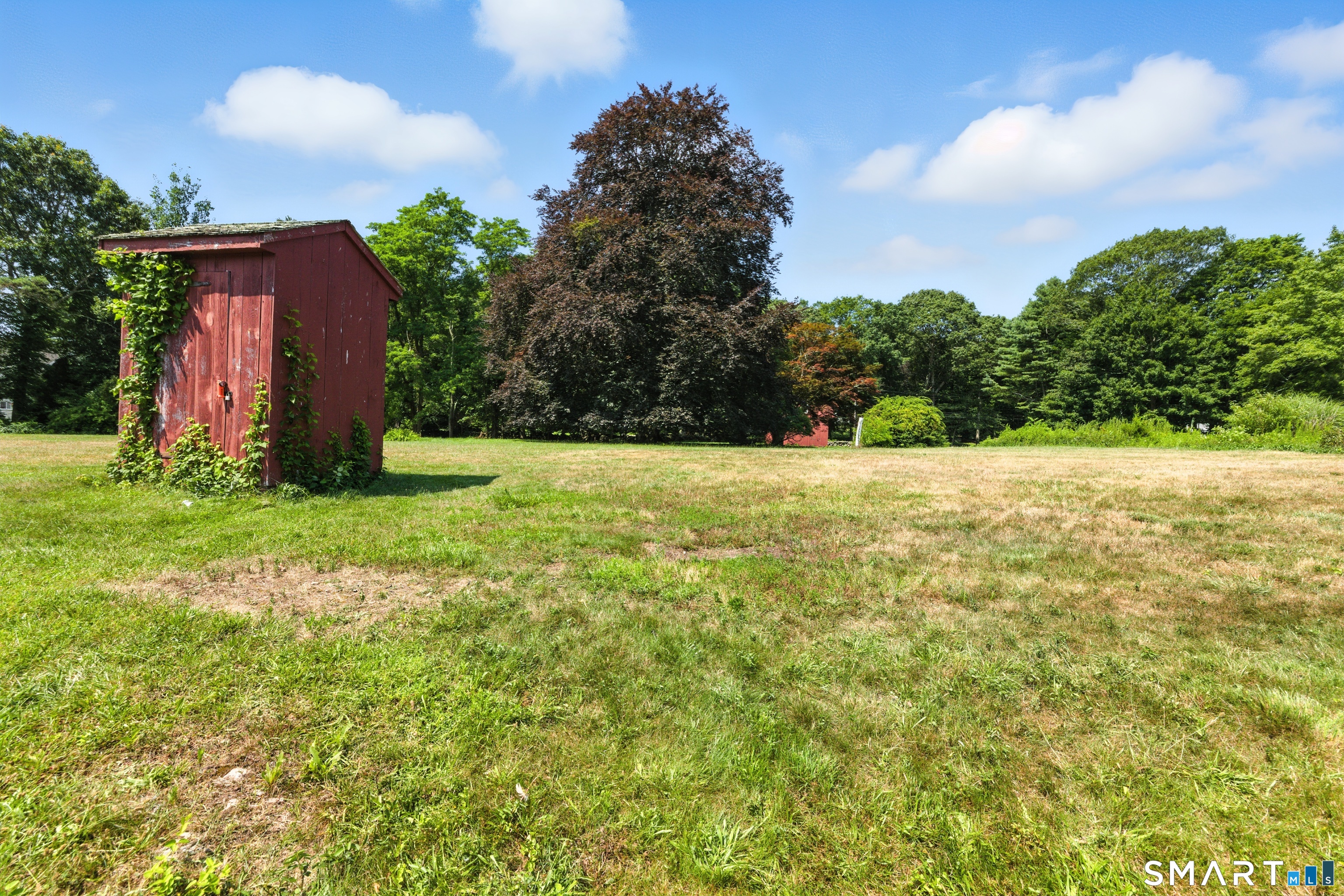 88 Cove Road Stonington, CT 06378 - Photo 19 of 27 a view of an outdoor space and a yard