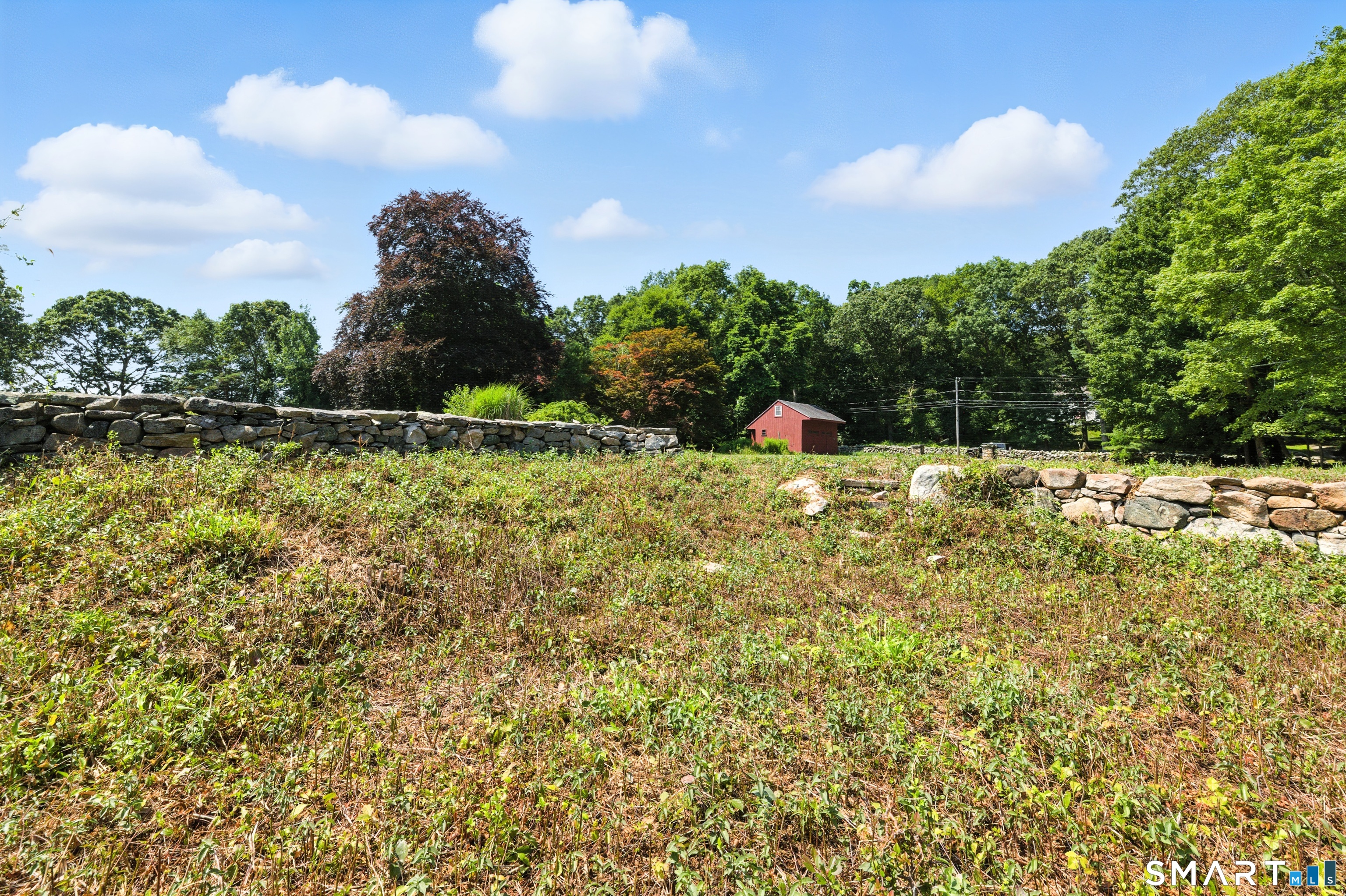88 Cove Road Stonington, CT 06378 - Photo 22 of 27 a view of a lake with houses
