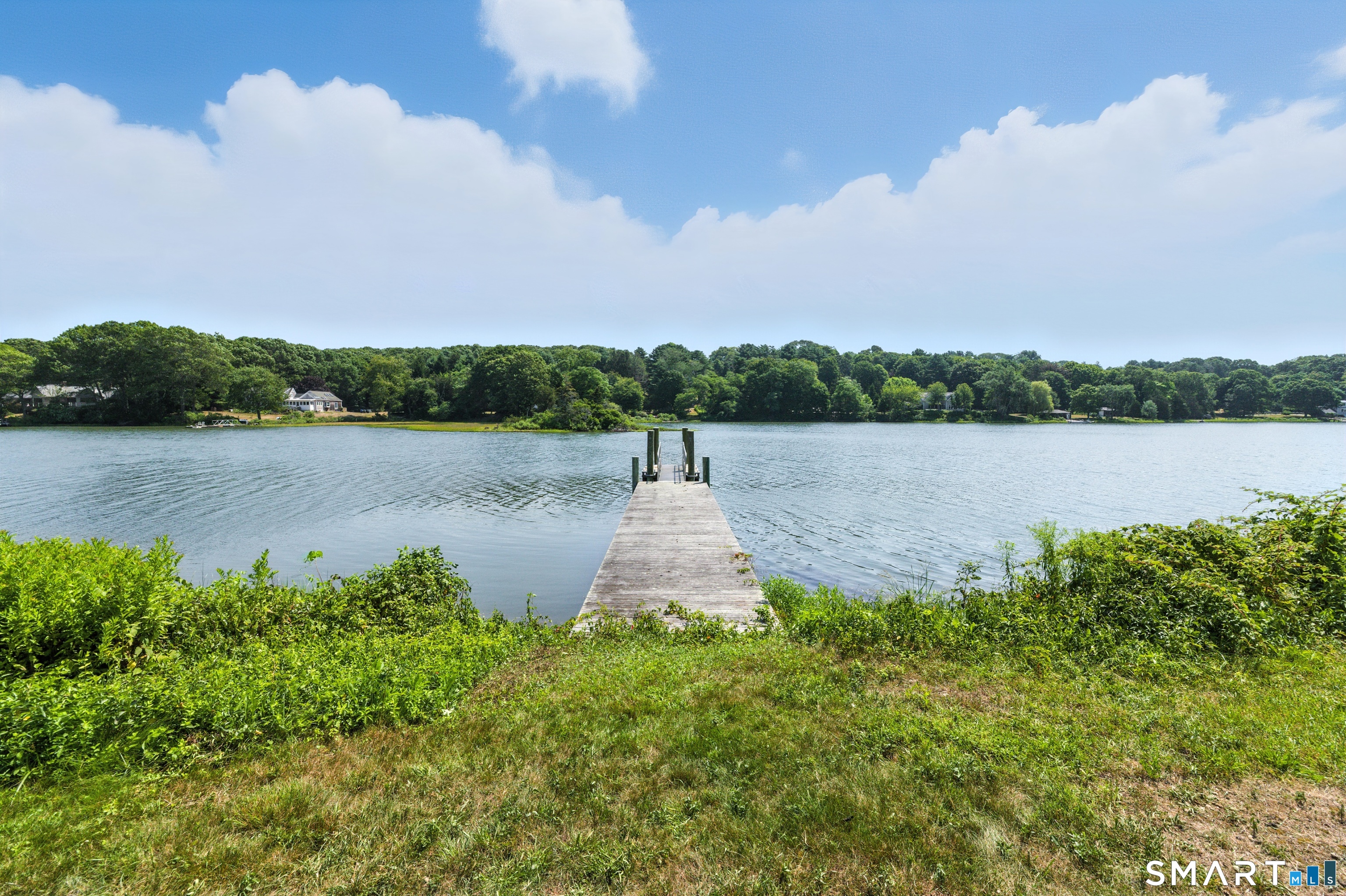 88 Cove Road Stonington, CT 06378 - Photo 3 of 27 a view of a lake with mountain in the background