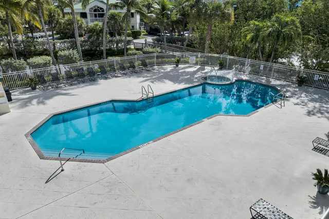 a view of a swimming pool with a patio