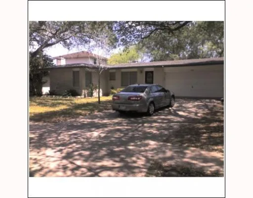 a view of a back yard of the house