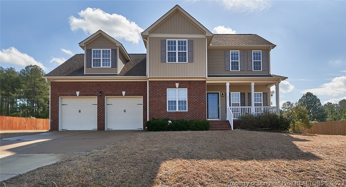 31 Reece Drive Sanford, NC 27332 - Photo 1 of 36 a front view of a house with garden