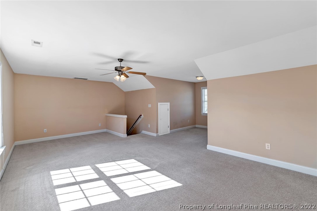 31 Reece Drive Sanford, NC 27332 - Photo 19 of 36 a view of a livingroom with a chandelier fan and a window